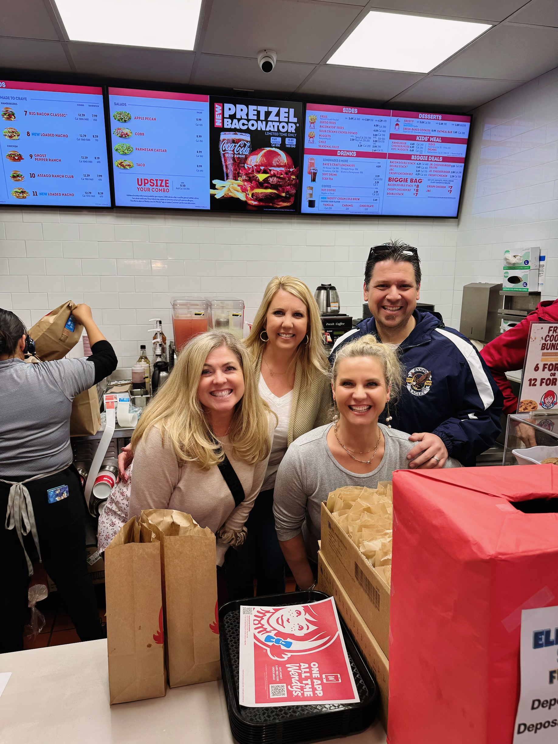 Evans Teachers serving up burgers and fries for our fundraiser!